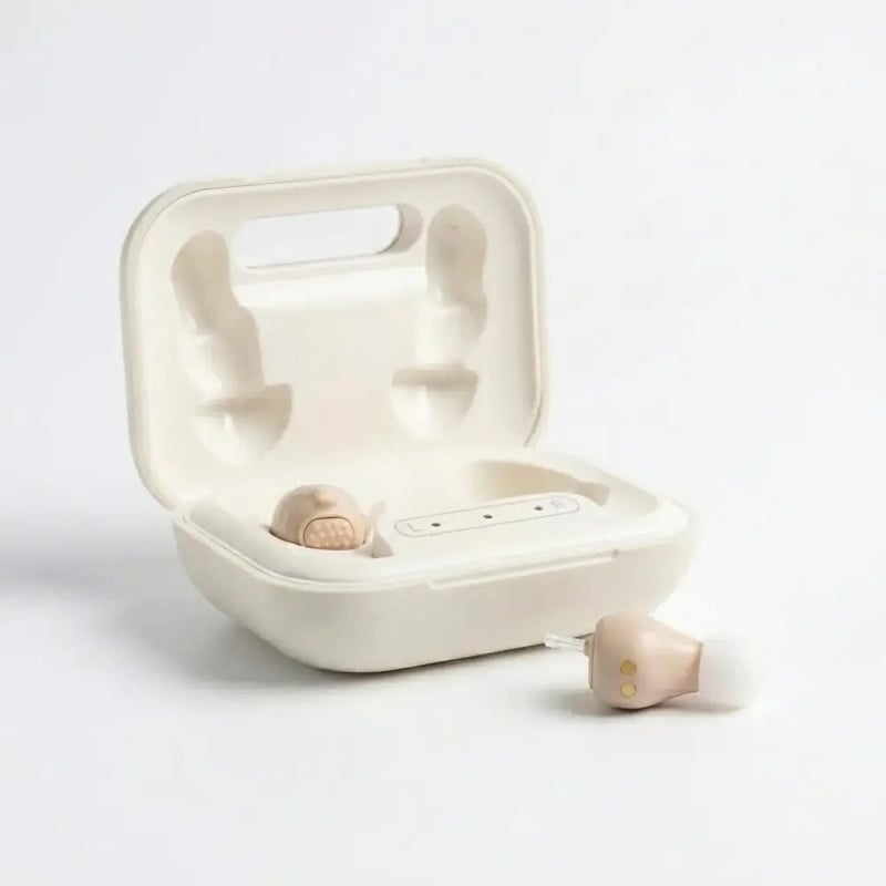 Future Hearing Comfort hearing aid pair beside its open charging case