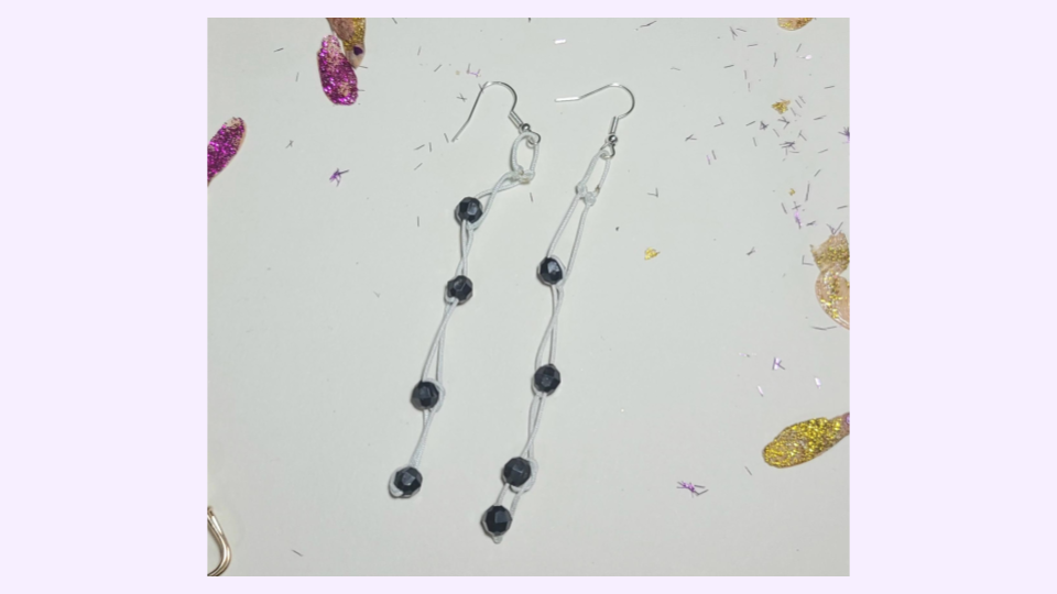 Obsidian-drift-white, faceted stone, knotted cord with silver tone