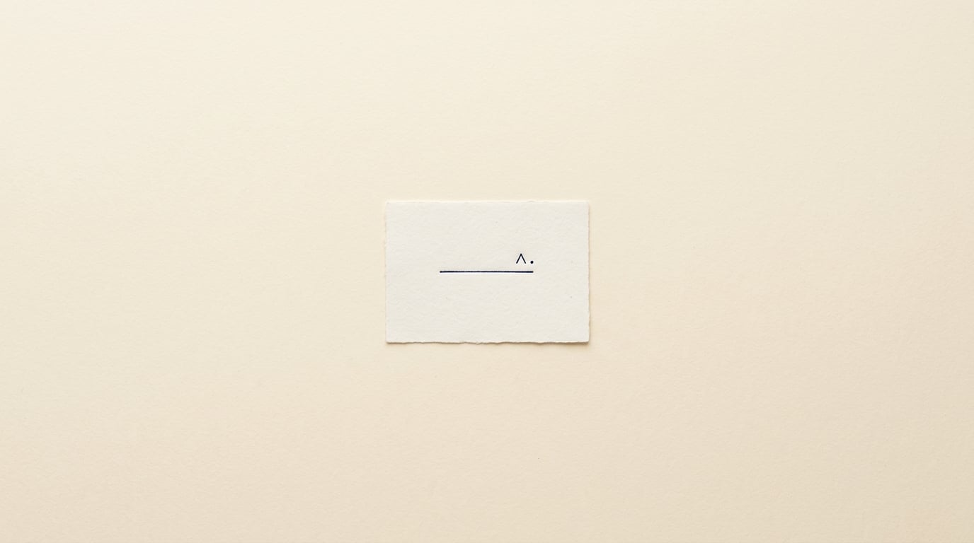 A small cream card with a proofreader mark on paper