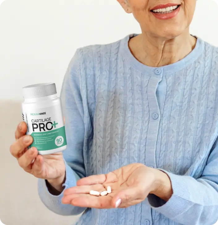 Person holding a bottle of cartilage supplements and a few pills in their hand.