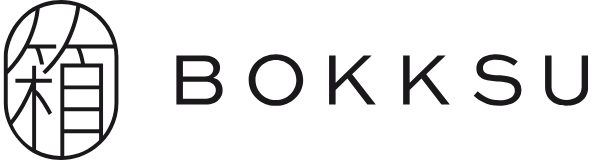 'Logo for Bokksu with Japanese character inside a circle.'