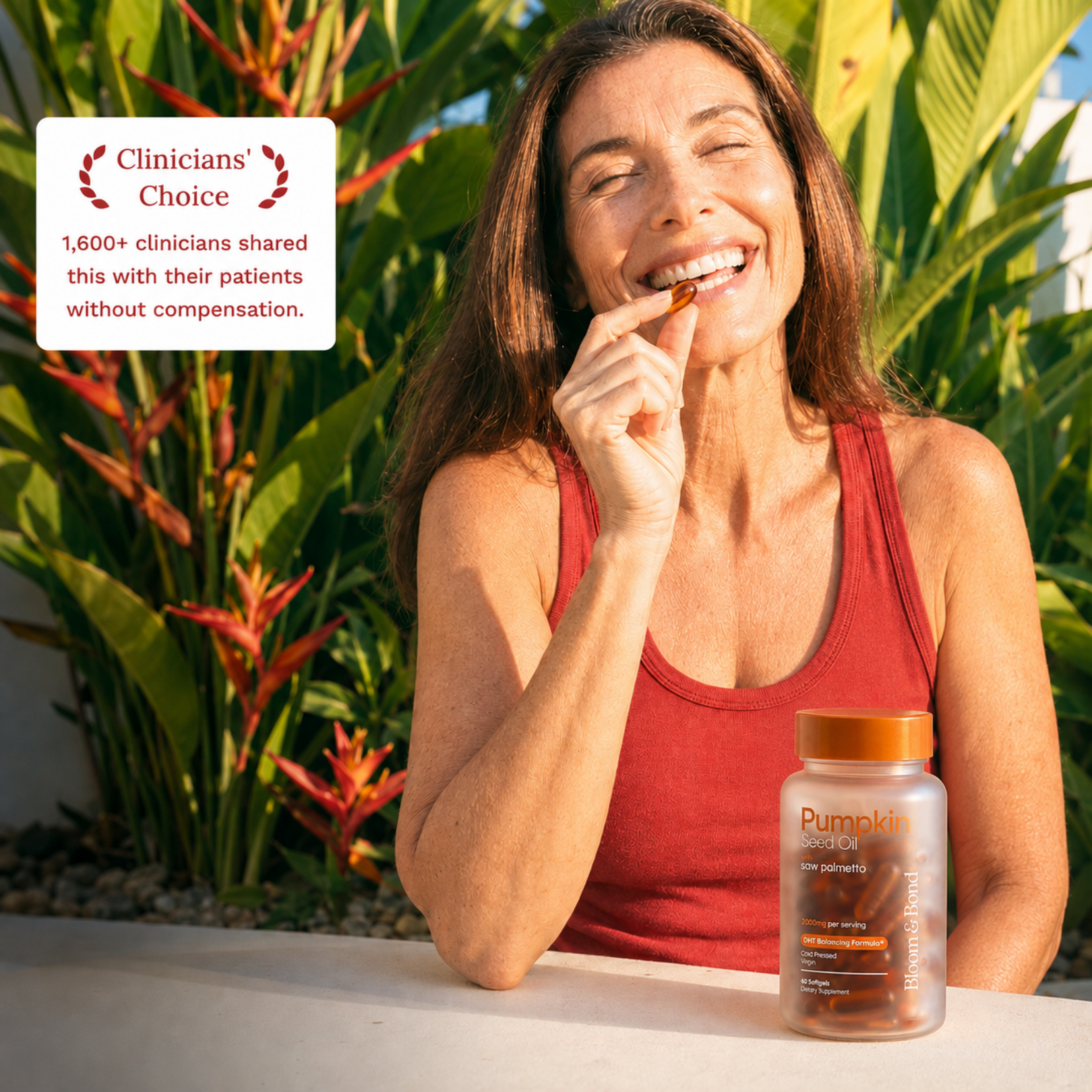 A woman smiles while taking a supplement softgel capsule outdoors, with the bottle sitting on a ledge.