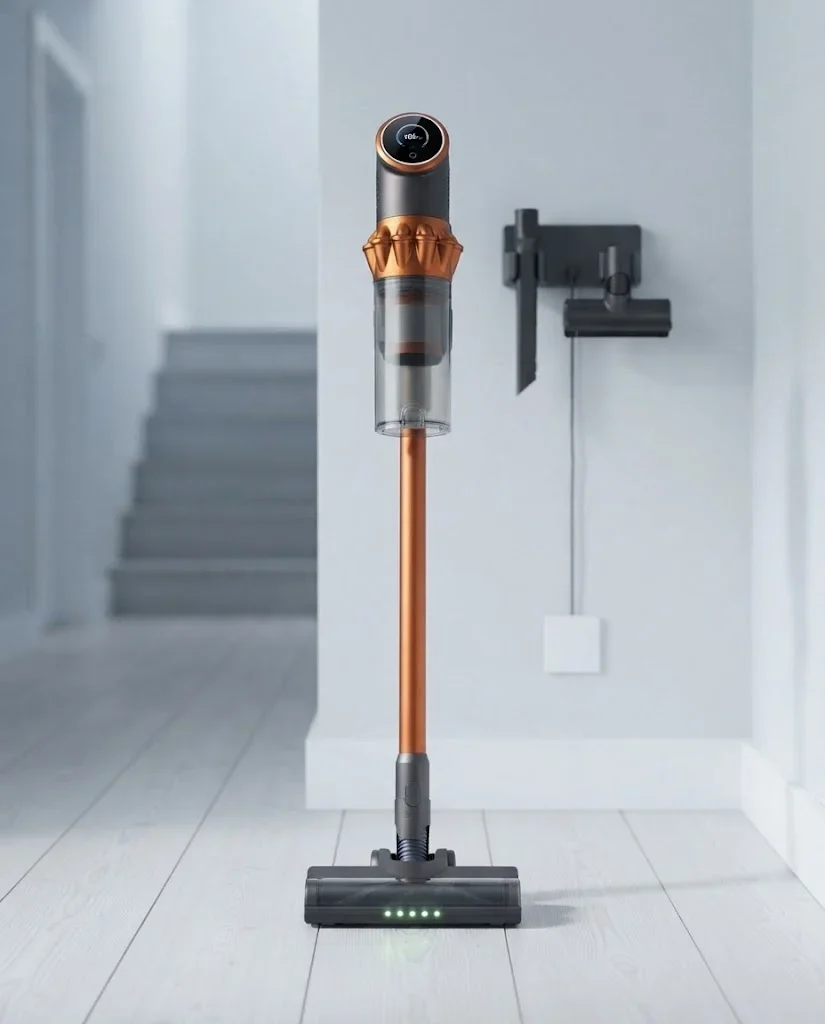 Vekto Vacuum V18 standing upright on its own in a bright hallway beside its wall dock with the tools hanging on it