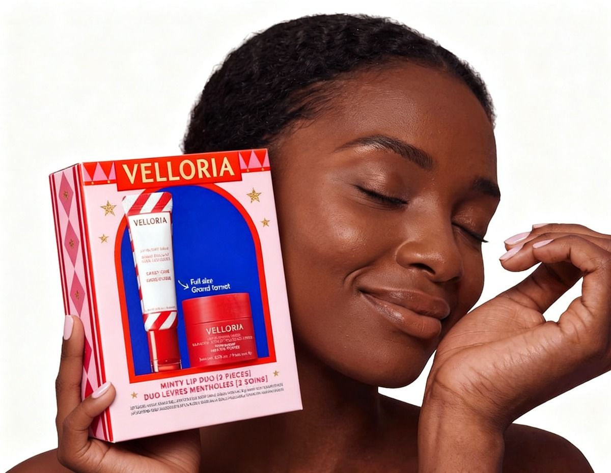 Woman holding the Velloria Minty Lip Duo gift box