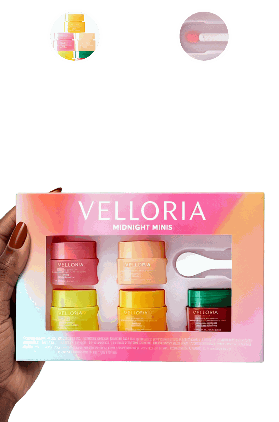 A hand holding the Velloria Midnight Minis gift box