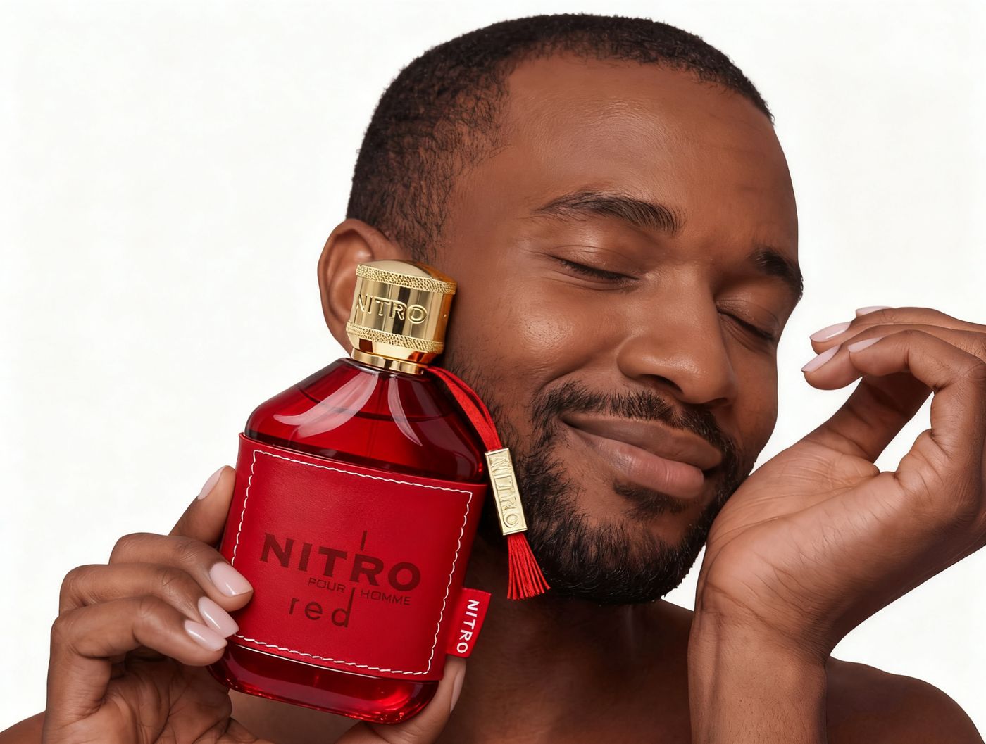 Man holding Dumont Paris Nitro Red against his cheek