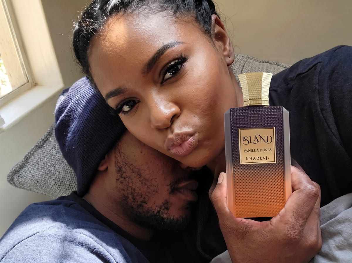 Couple cuddling, she holds Khadlaj Island Vanilla Dunes